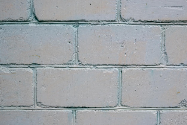 white brickwork with rust spots