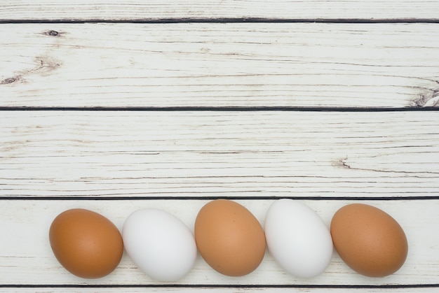 White and brown Easter eggs on the table