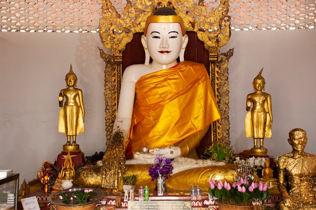 White buddha statue burma style in church for Thai people and foreign travelers travel visit and respect praying at Wat Phra That Doi Kong Mu Temple on February 28 2020 in Mae Hong Son Thailand