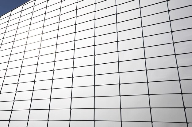 A white building background with a grid pattern on it