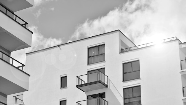 a white building with balconies on the top and the balconies on the top.