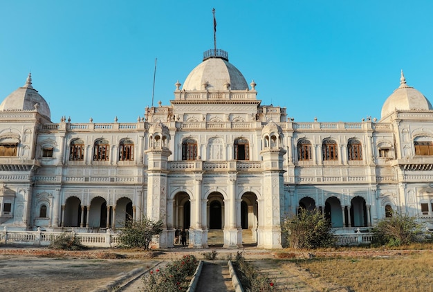 A white building with a dome and a large dome with the word love on it.