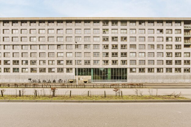 A white building with a street in front of it