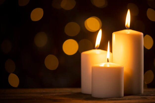 White burning candles on the table