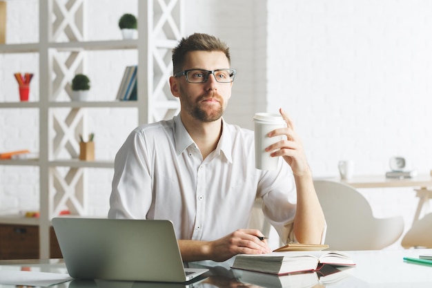 White businessman working on project