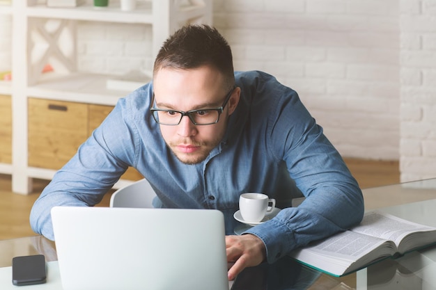 White businessperson working on project