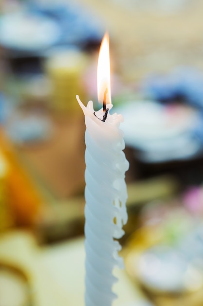 White candle on table for wedding ceremony