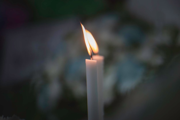 White candle with a small flame