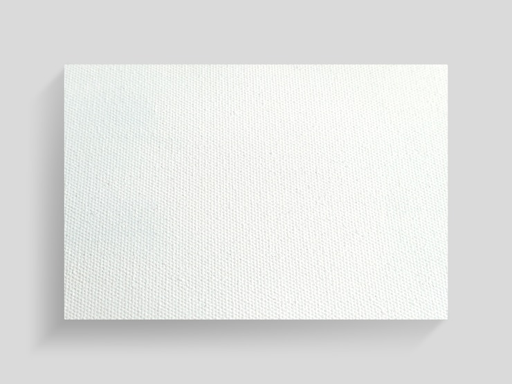 Photo white canvas frame on gray wall background.