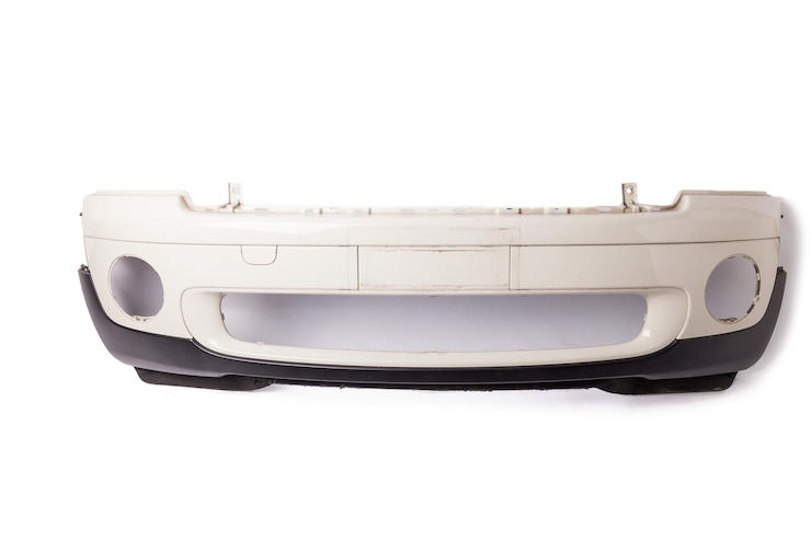 Photo white car bumper with a black plastic panel on an isolated background part for installation on a car body after repair and painting during repair in a workshop equipment for sale