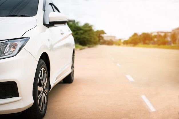 White car parked on the side of the road