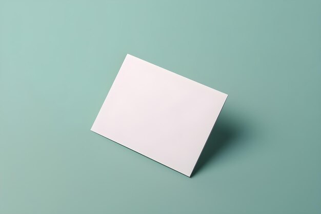 Photo a white card on a green background