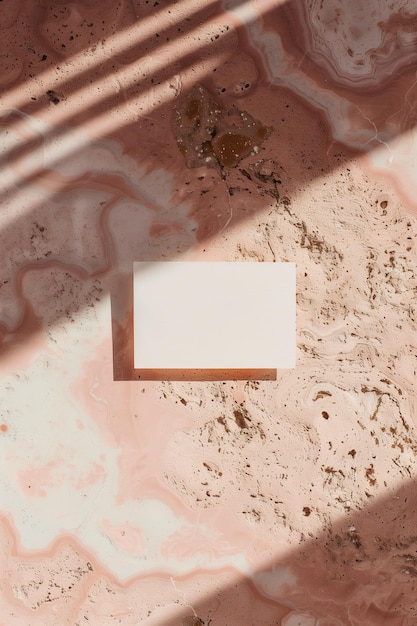 Photo a white card is placed on a pink surface