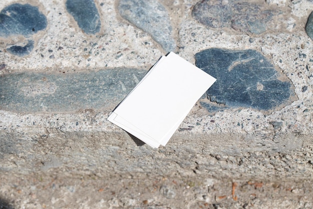 A white card laying on a sidewalk that says " i'm not a person ".