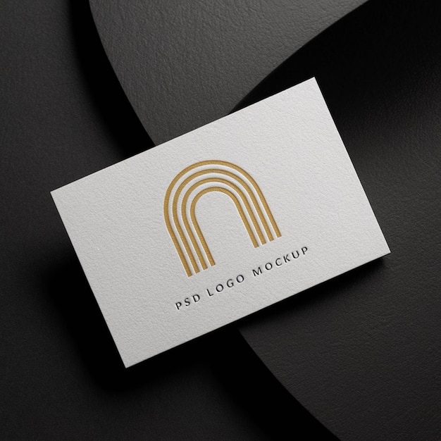 a white card with a gold logo on it