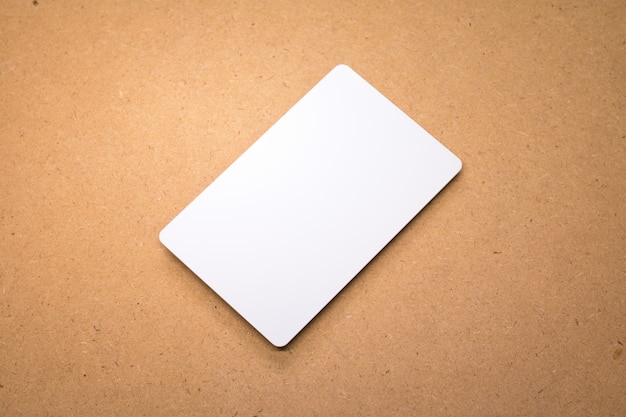 White card on wooden background