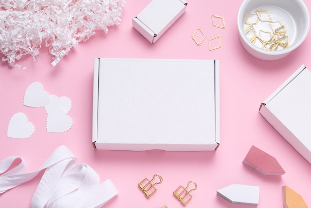 White cardboard box on color office desk