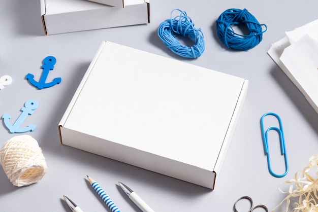 White cardboard box on office desk, Navy concept