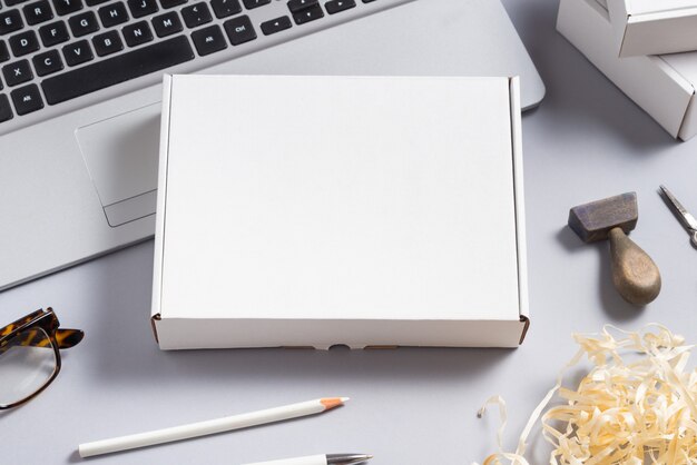 White cardboard box on office desk