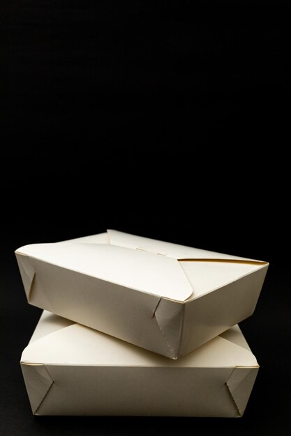 White cardboard takeout boxes an urban living concept home delivery