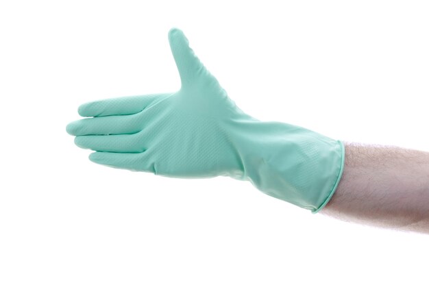 White caucasian male hand with green latex glove open palm against white background