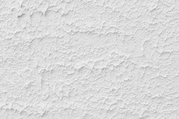 배경에 대한 자연스러운 패턴이 있는 흰색 시멘트 벽 텍스처