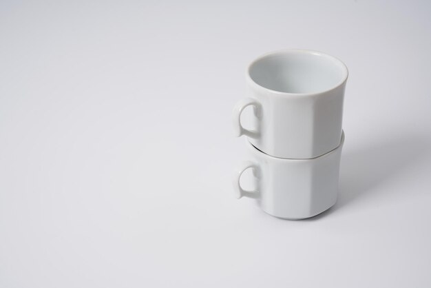 White ceramic coffee cups on a white background