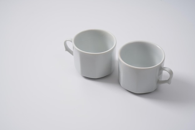 White ceramic coffee cups on a white background