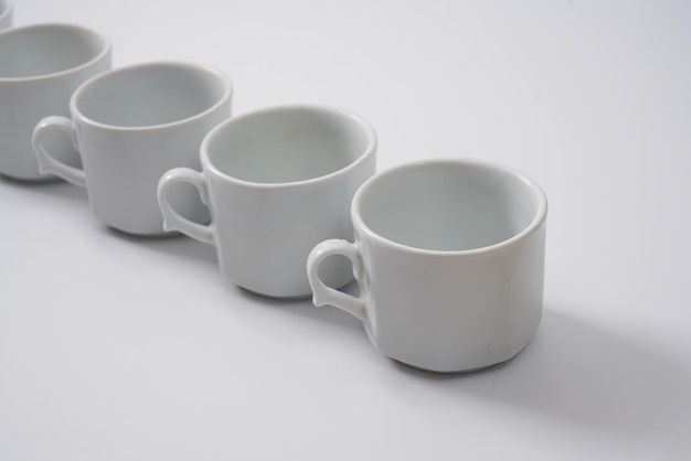 White ceramic coffee cups on a white background