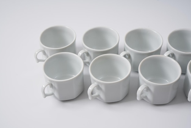 White ceramic coffee cups on a white background