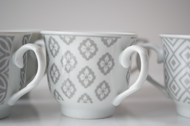 white ceramic empty tea cup on table