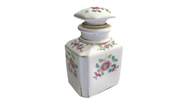 A white ceramic jar with a floral design on the front.