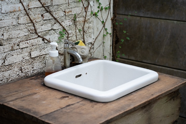 White ceramic sink in the garden, vintage garden