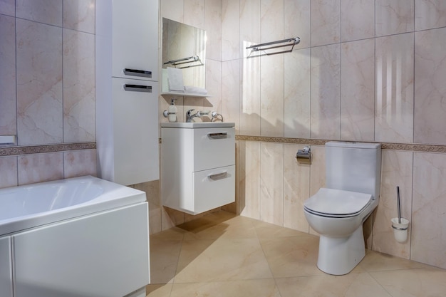 White ceramic toilet bowl in restroom