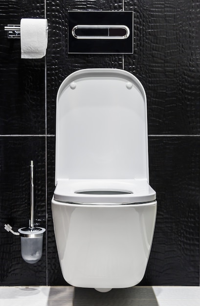 White ceramic toilet with the lid open