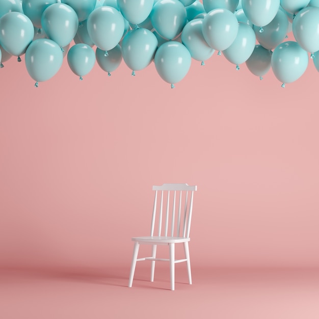 Photo white chair with floating blue balloons in pink background room studio