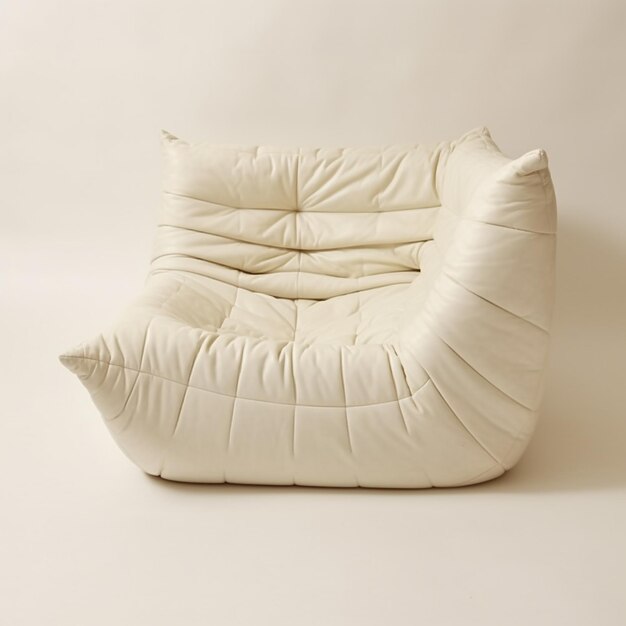 a white chair with a white pillow on it and a white pillow on the back.