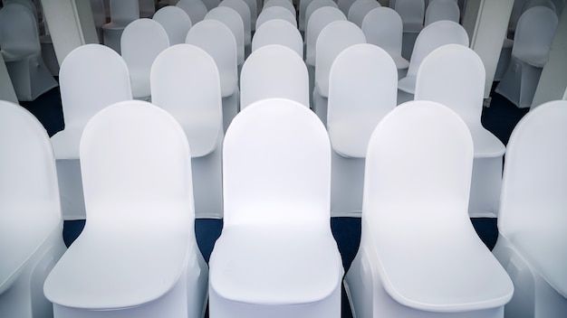 White chairs arranged in a seminar room