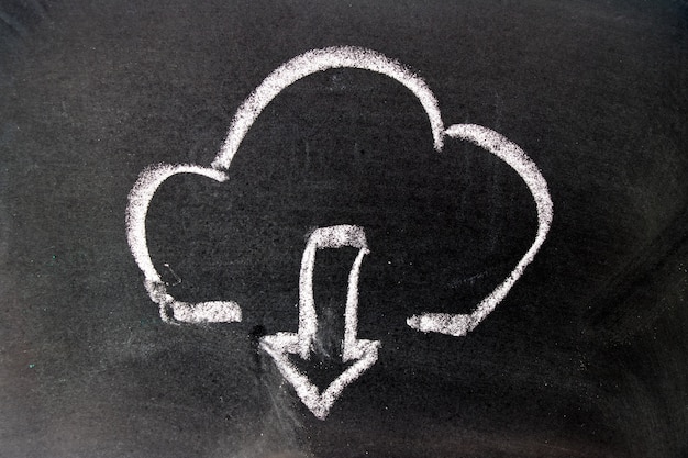 Photo white chalk drawing as cloud  and down arrow icon on black board background