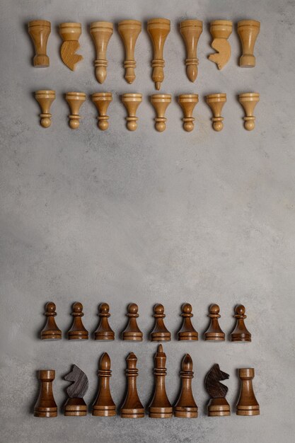 Photo white chess pieces against black chess pieces