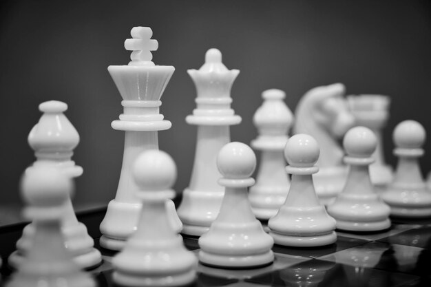 White chess pieces chessboard with gray background