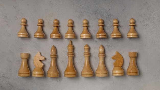 White chess pieces on a light background