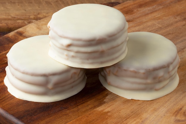 White chocolate alfajor on cutting board