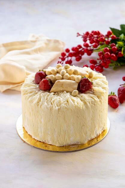 White chocolate banana cake on a white background White Birthday cake