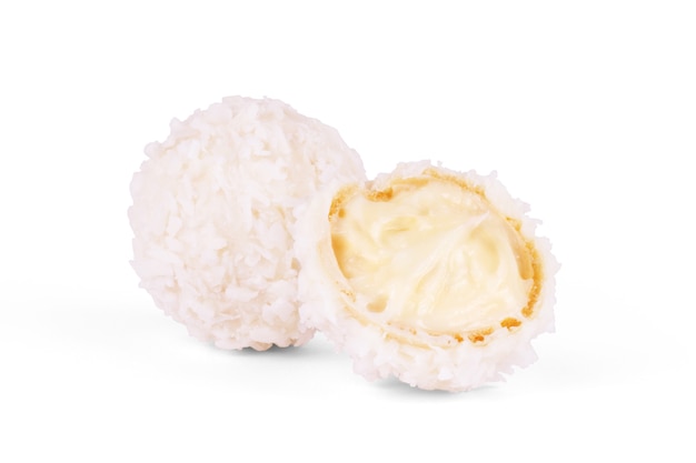 Photo white chocolate candy with coconut topping on white background