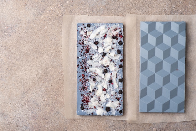White chocolate stained with tea Anchan and freeze-dried blueberries