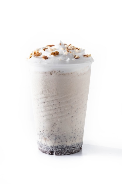 White chocolate, vanilla and nuts iced milkshake isolated on white