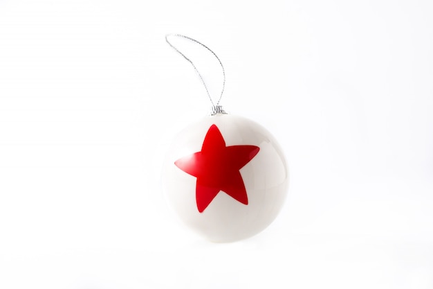 White Christmas ball with red star isolated 