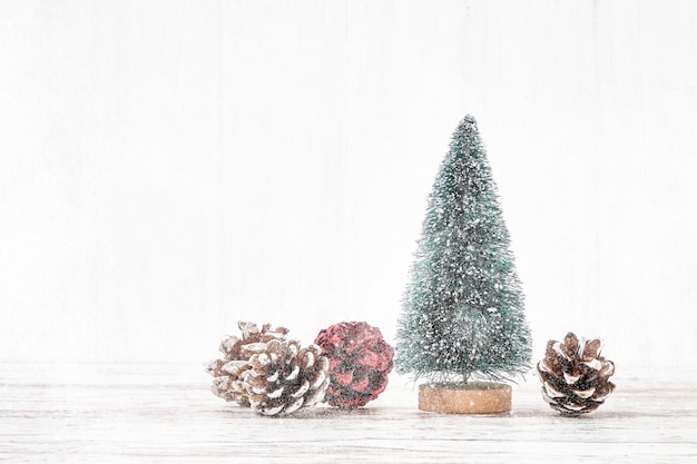 White Christmas . Decorative Christmas tree on white background. Snow texture, copyspace