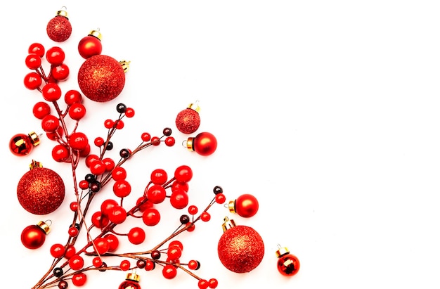 White Christmas and New Year background with red Christmas balls and berries top viewcopy spase